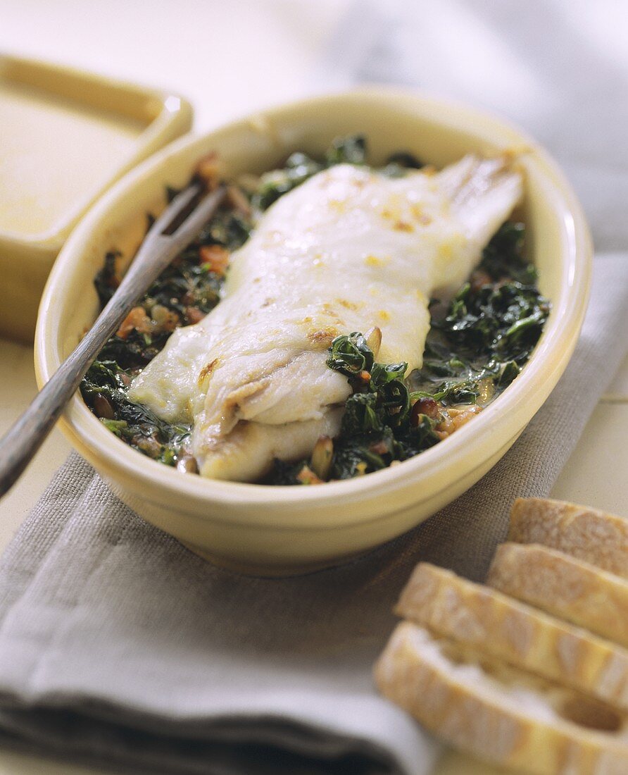 Baked grey mullet with spinach and mozzarella