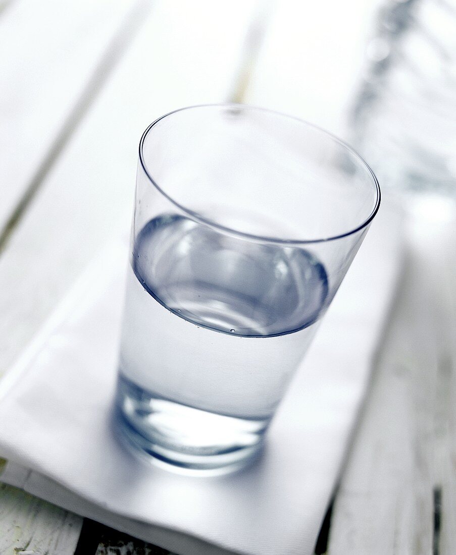 Glass of Water on White Napkin