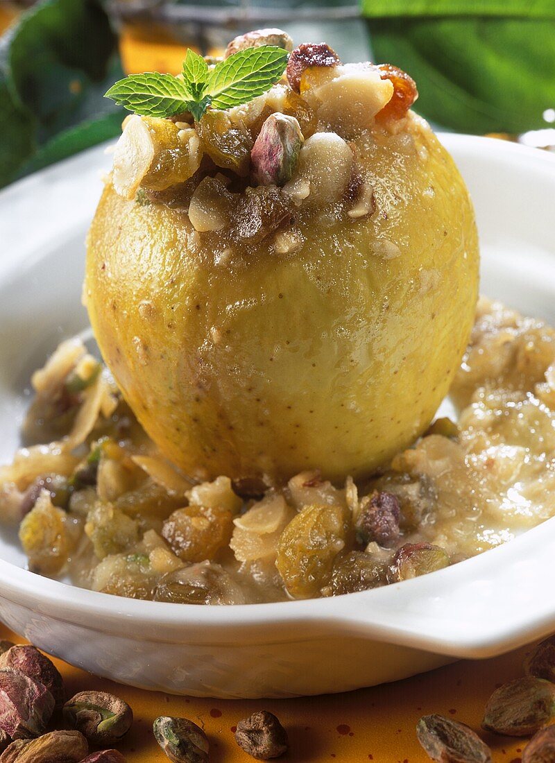 Baked apple with raisins, pistachios and almonds