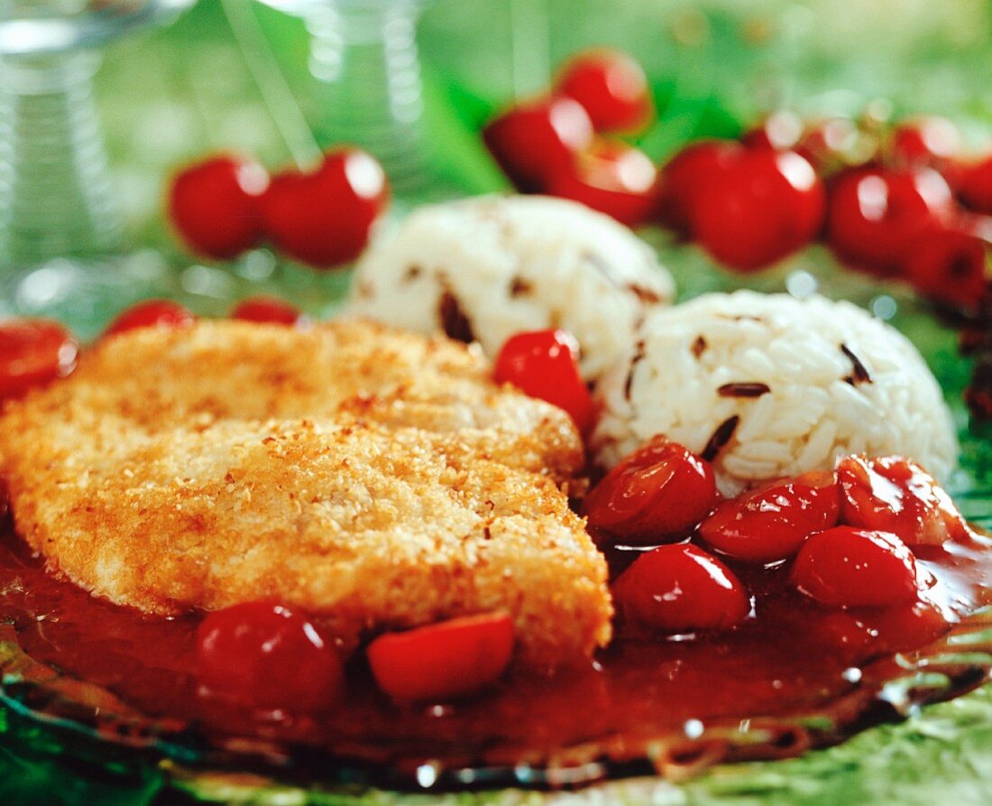 Chicken breast in coconut panade with cherry sauce & rice