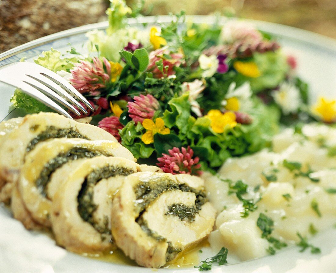 Turkey roulade with white asparagus and flower salad