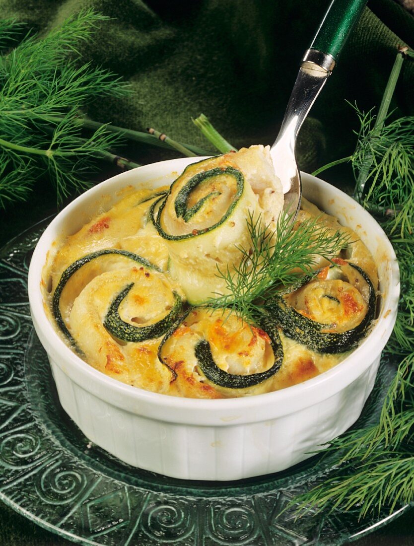 Courgette and fish roulade au gratin