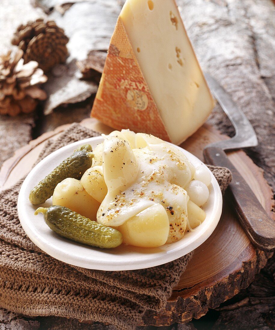 Raclette with boiled potatoes and gherkins (Switzerland)