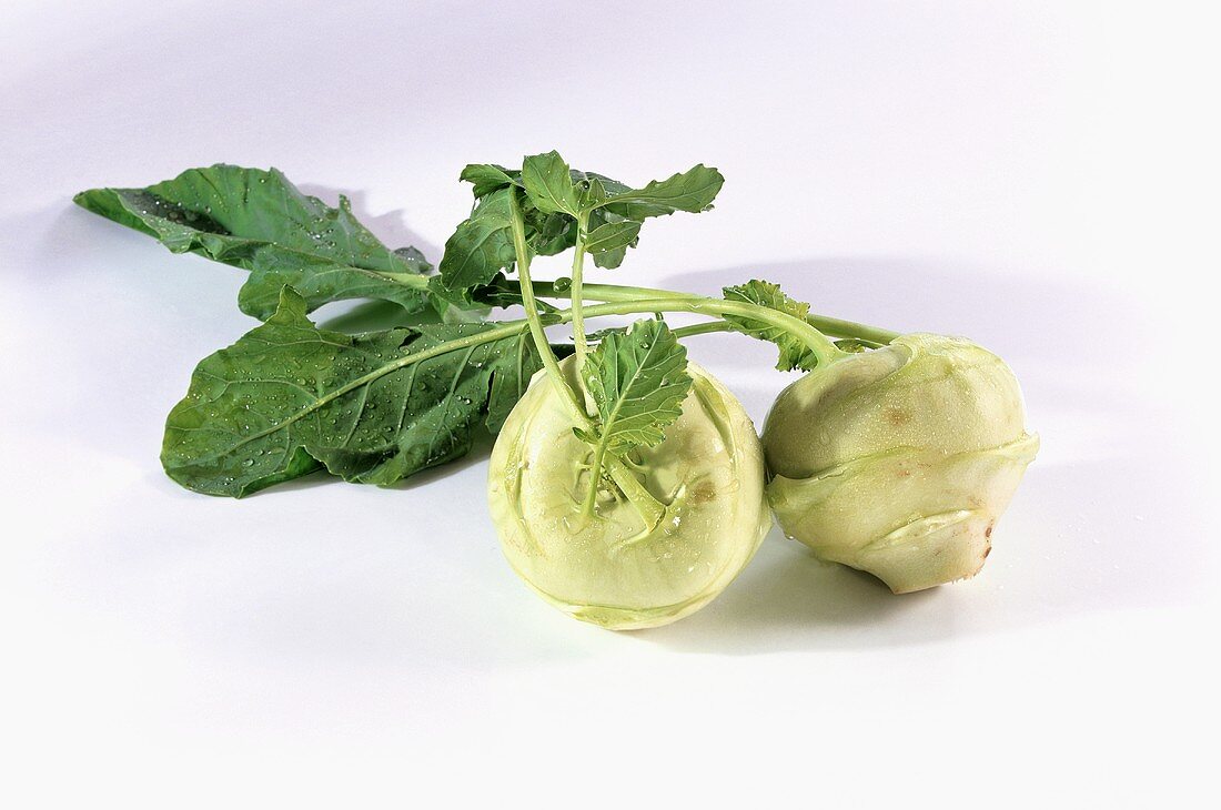 Two kohlrabi with drops of water