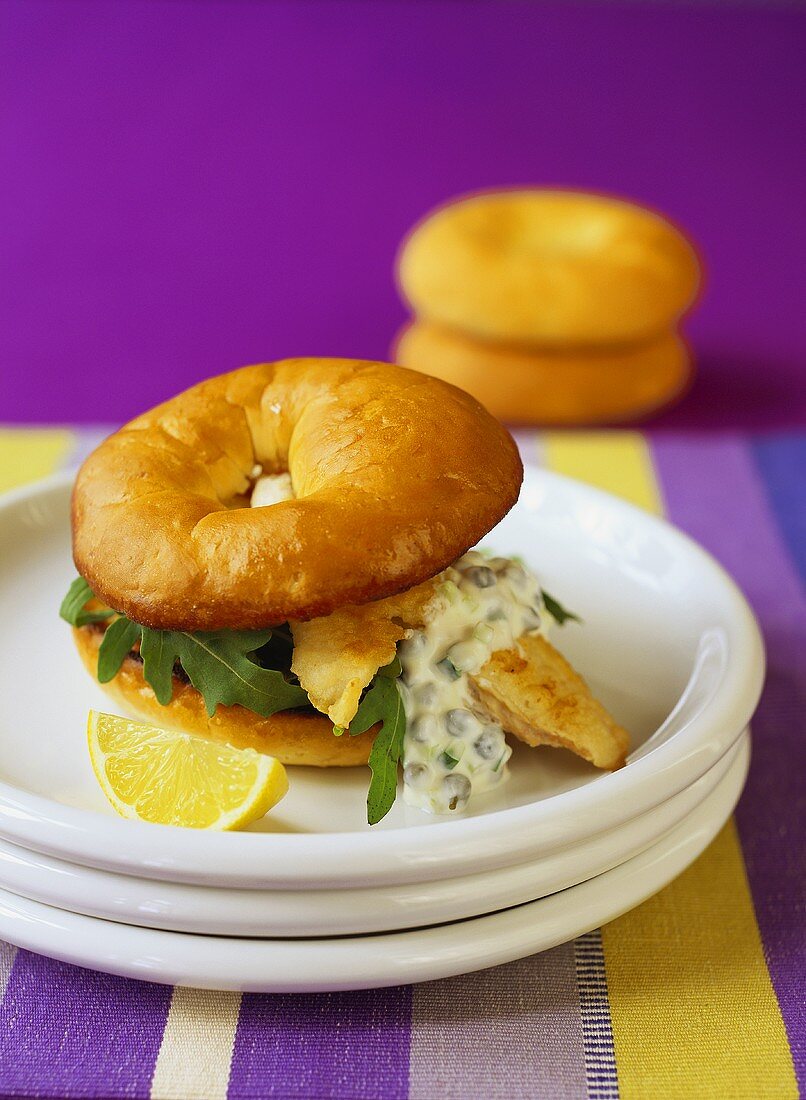 Fish burger with caper sauce and rocket