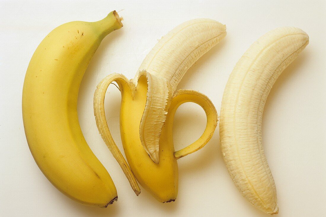 Banana; half-peeled and peeled