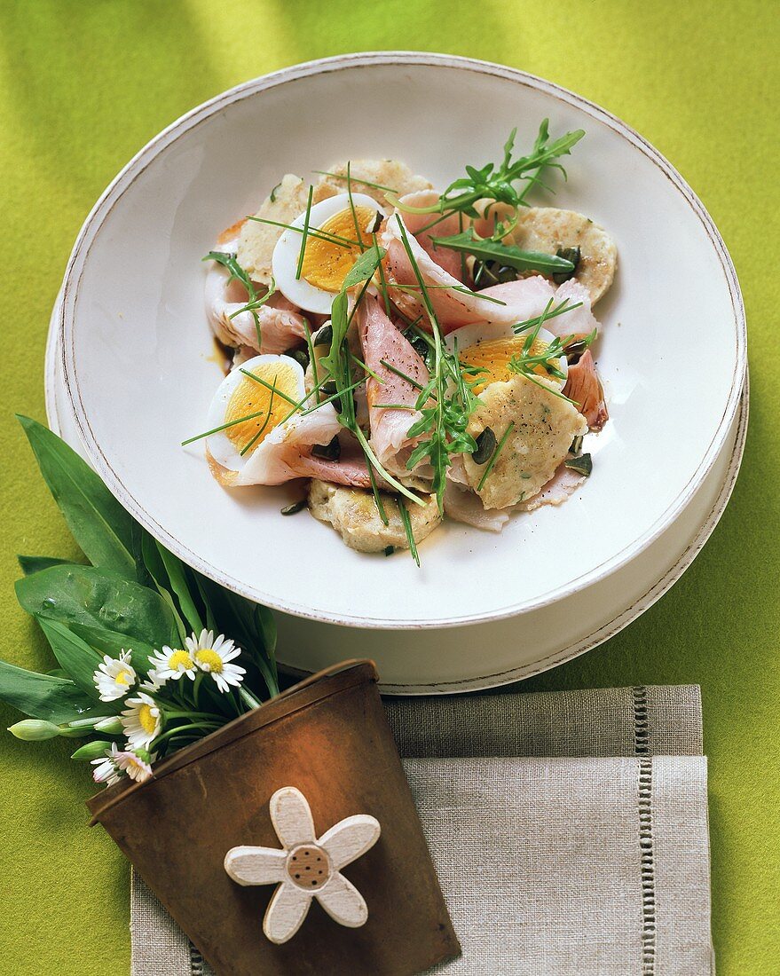 Sausage salad with egg and bread dumplings