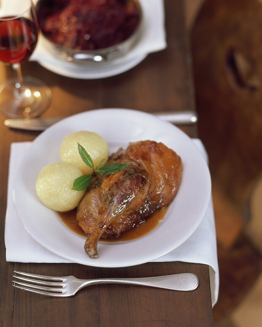 Duck with potato dumplings; red cabbage
