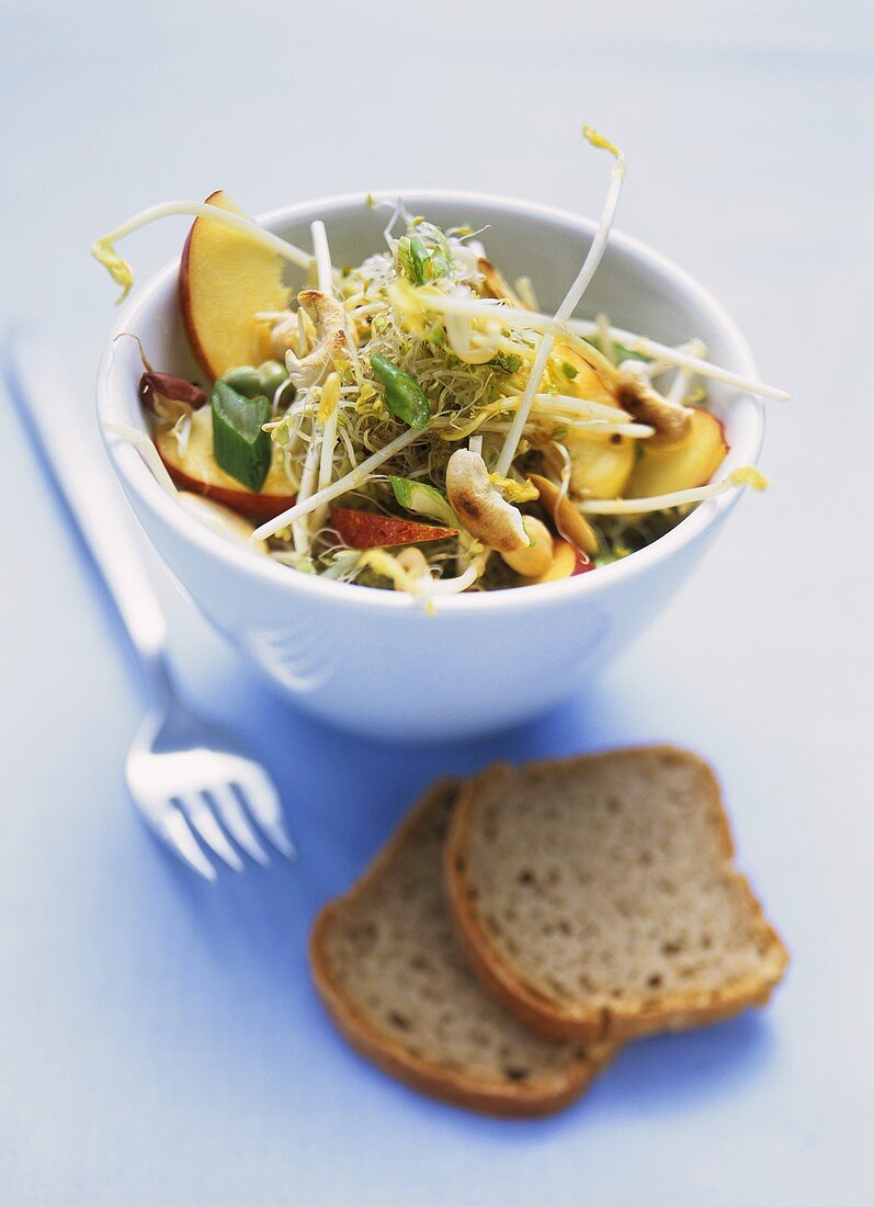 Sprout salad with nectarines & cashew nuts; wholemeal bread