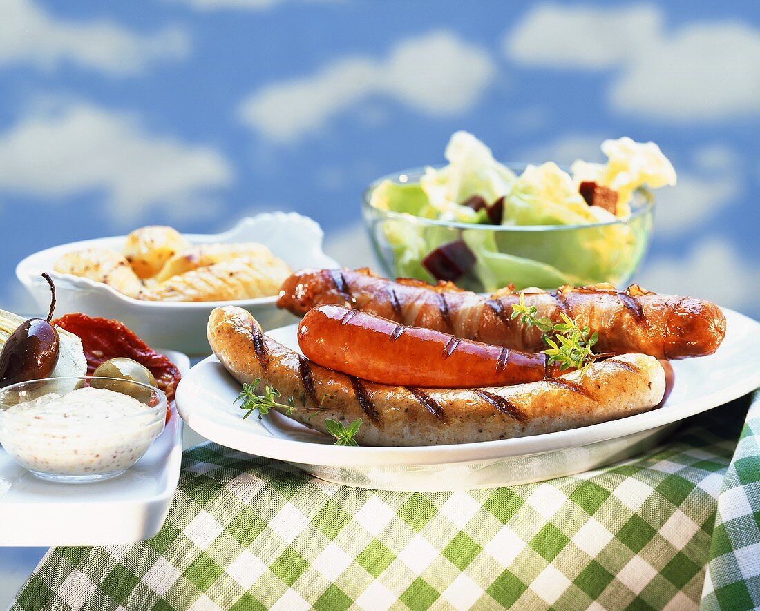 Grilled sausages with various accompaniments