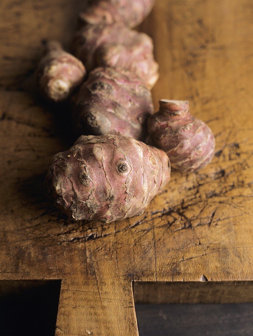 Jerusalem artichoke on wooden chopping board