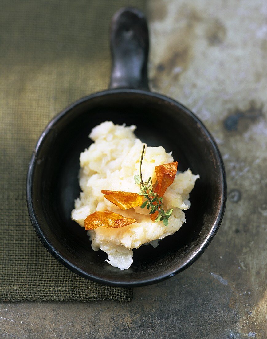 Scorzonera puree with sprig of thyme