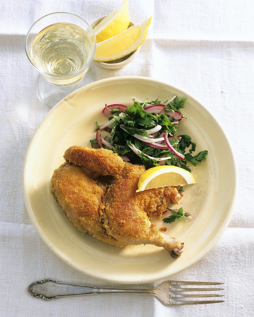 Breaded poussin with parsley salad