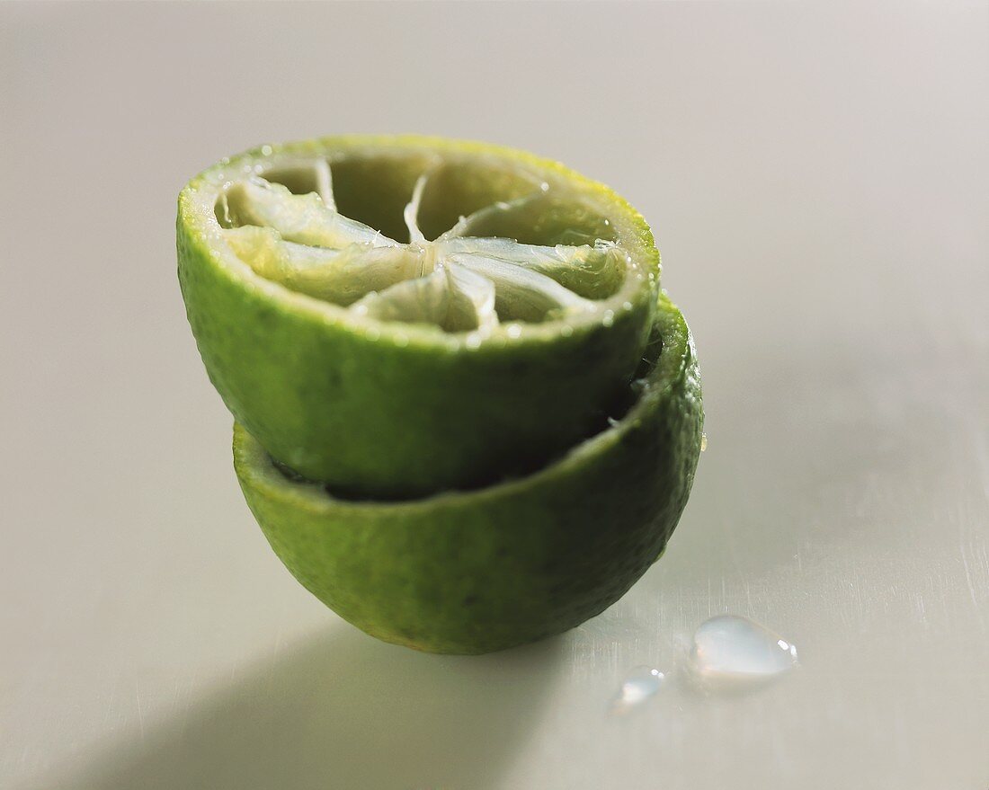 Two squeezed lime halves