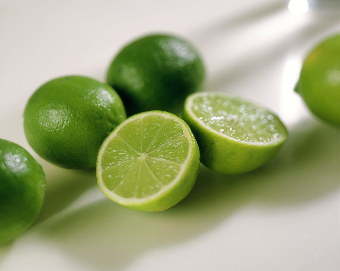 Limes, one halved