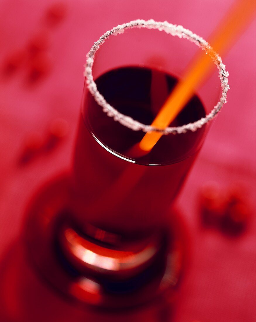 Glass of berry juice with sugared rim