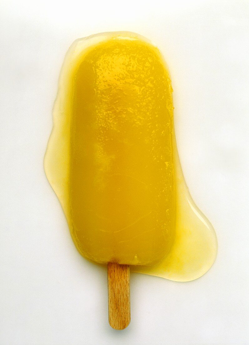 Yellow ice lolly, melting