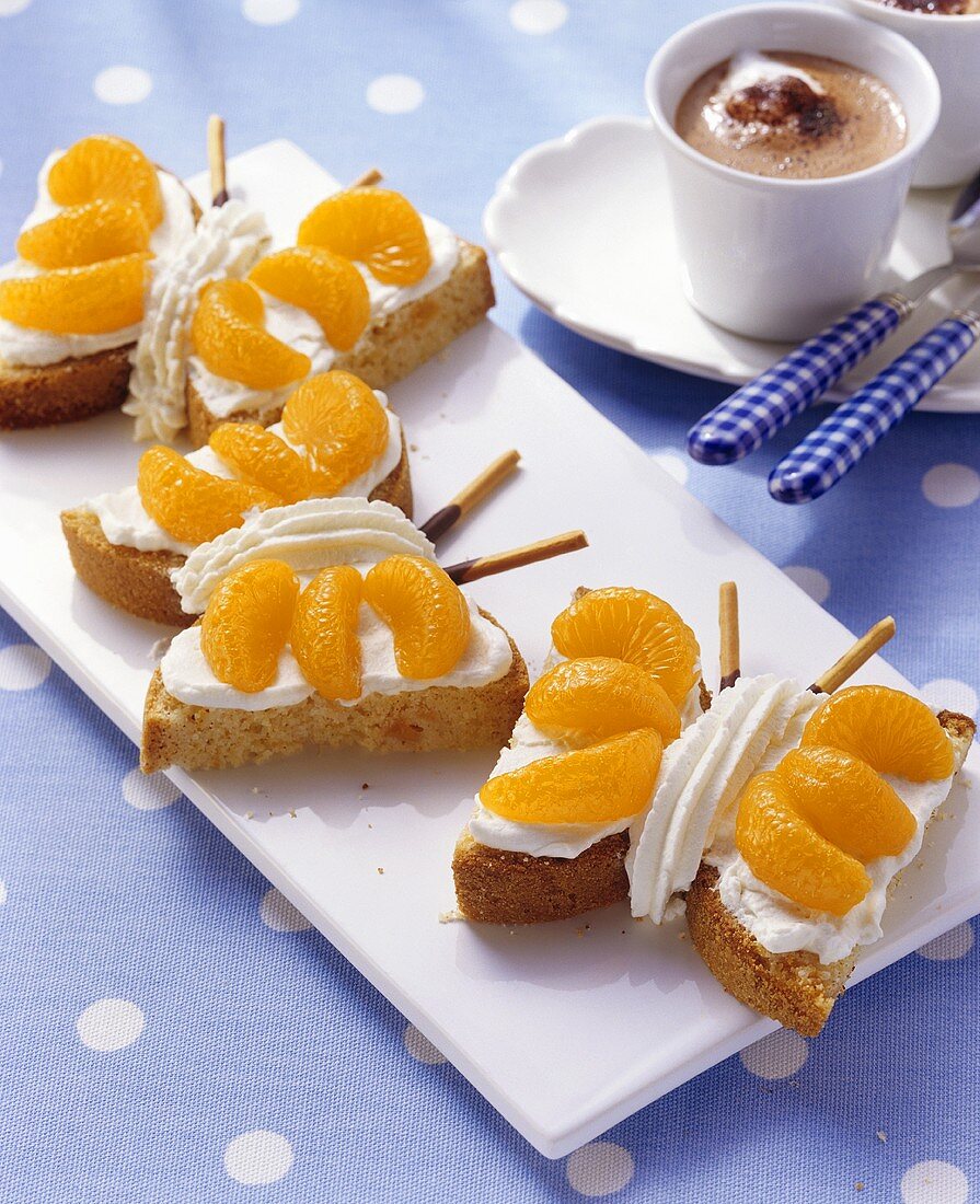 Marzipan cake butterflies with mandarin oranges for children