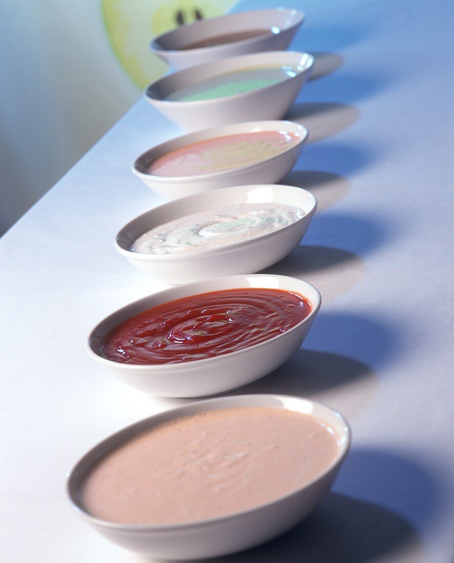 Various sauces in small bowls