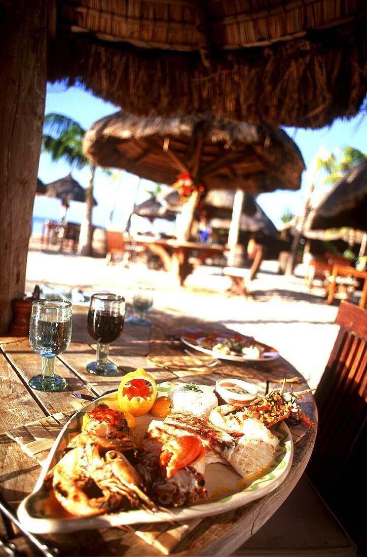 Fish platter with seafood on beach