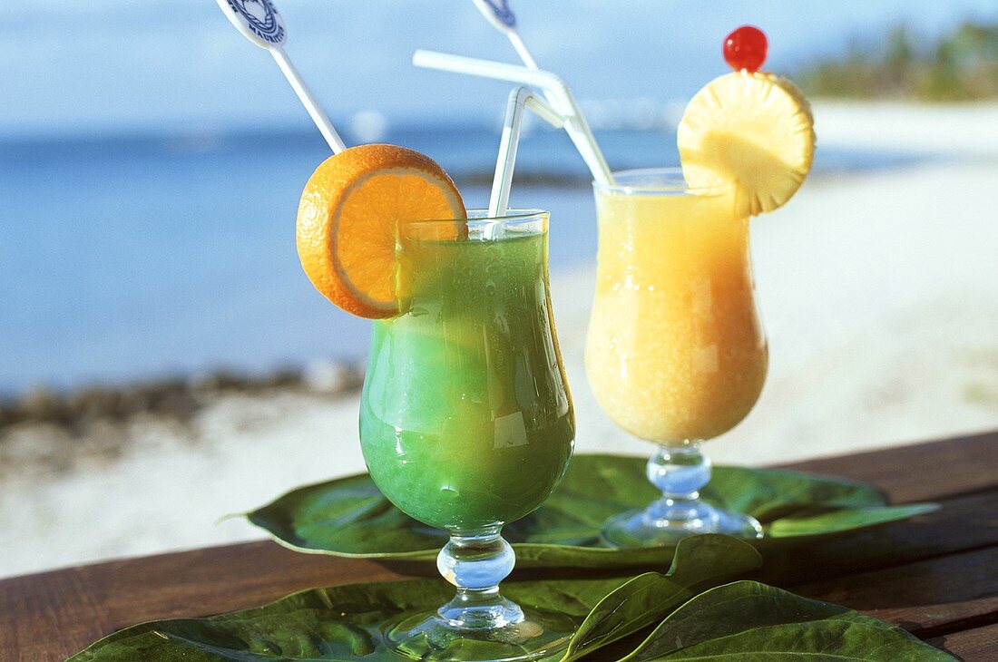 Two exotic cocktails on seashore
