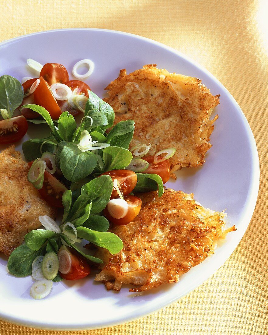 Cheese and potato rosti with corn salad