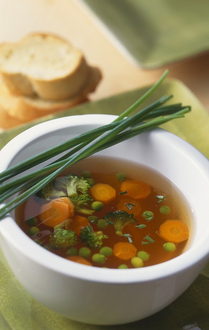 Clear vegetable soup with chives