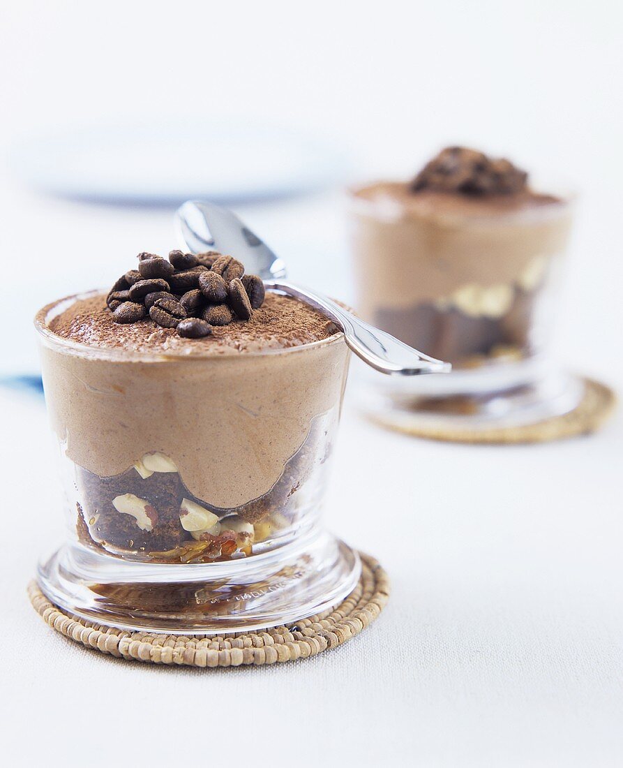 Chocolate mousse with coffee beans in a glass