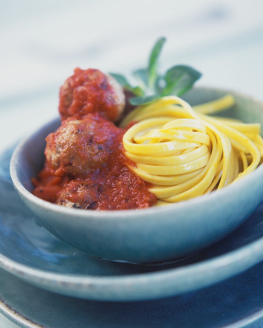 Meatballs with tomato sauce and ribbon noodles