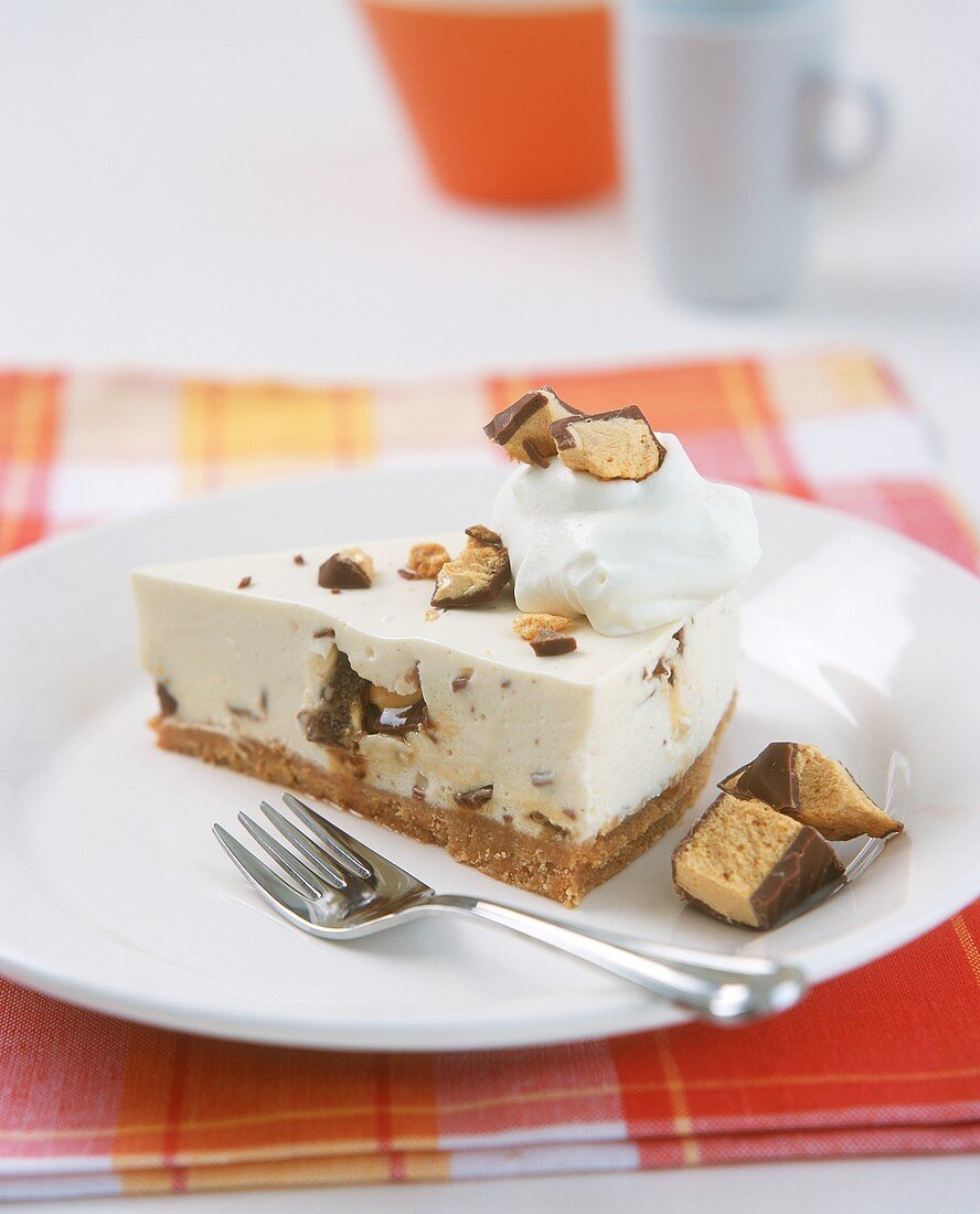 A piece of cheesecake with chocolate crispies