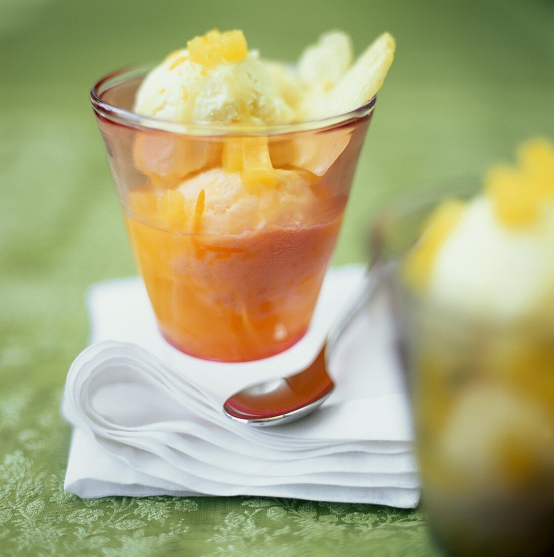 Orange and kumquat ice cream in a sundae glass