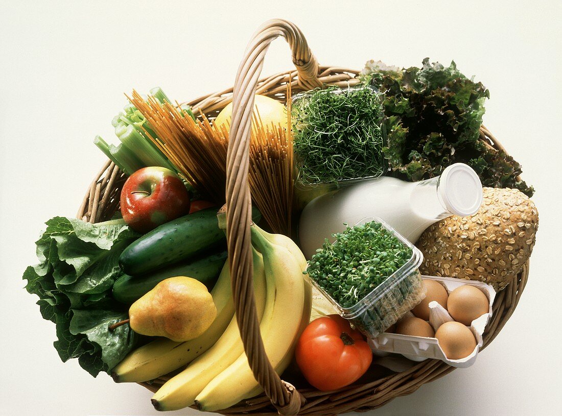 Wicker basket with various foodstuffs