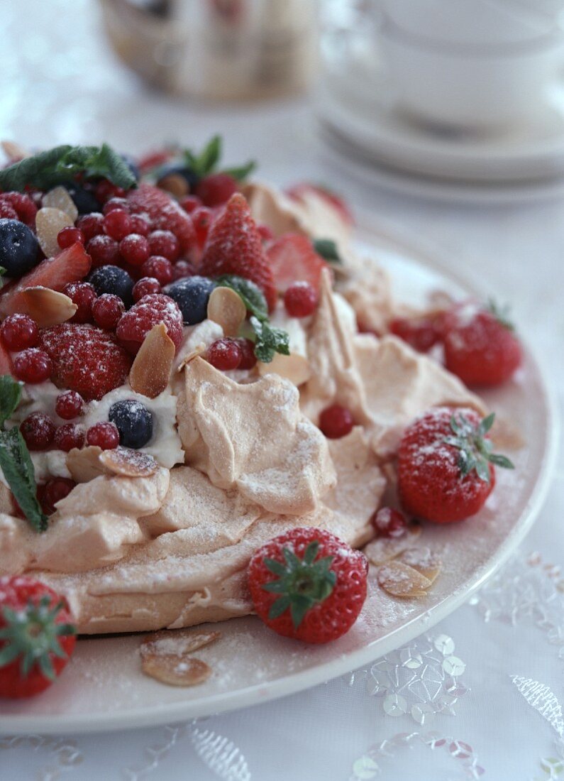 Meringue tart with cream and mixed berries