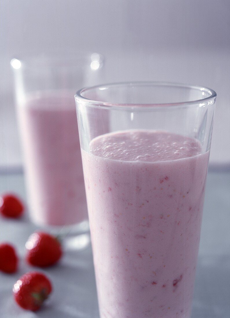 Two glasses of strawberry milk shake