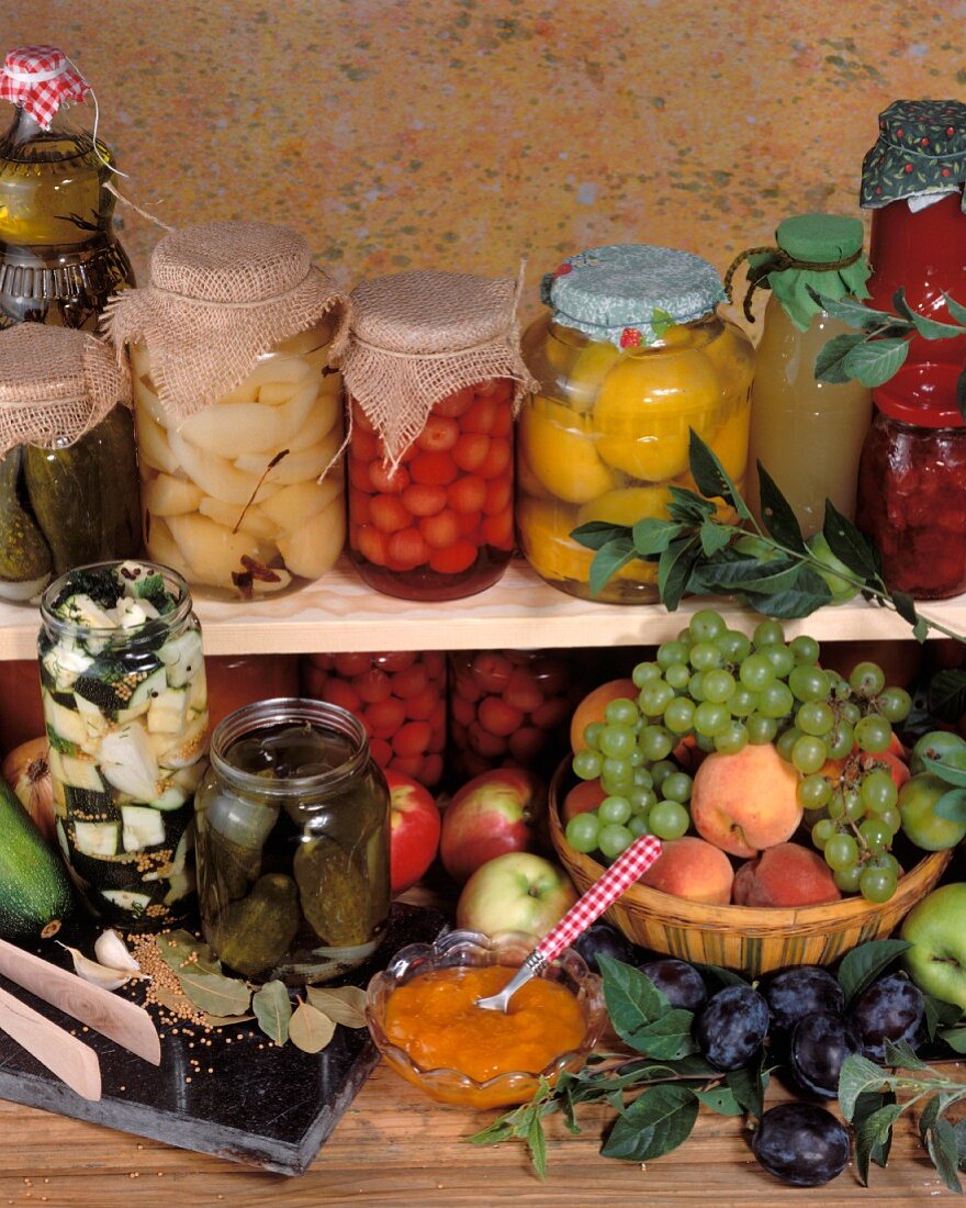 Still life: bottled fruit, vegetable and fruit basket