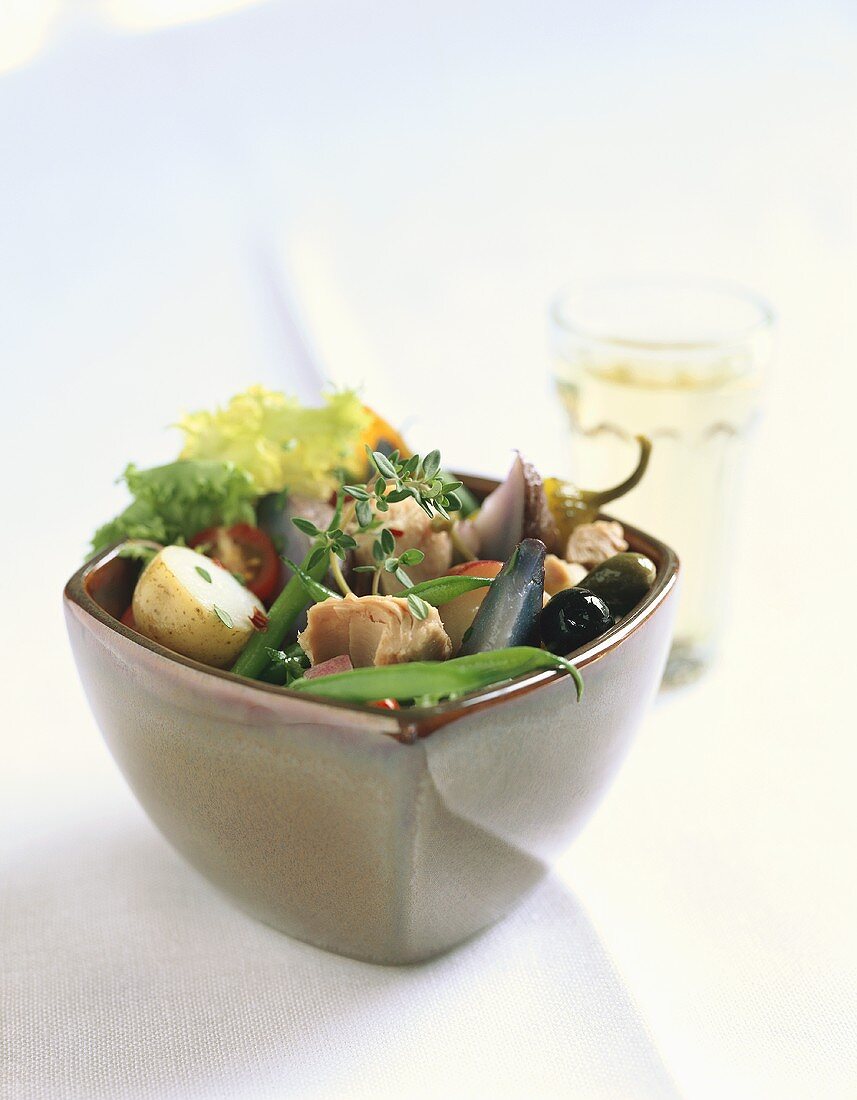 Salade nicoise in a small bowl