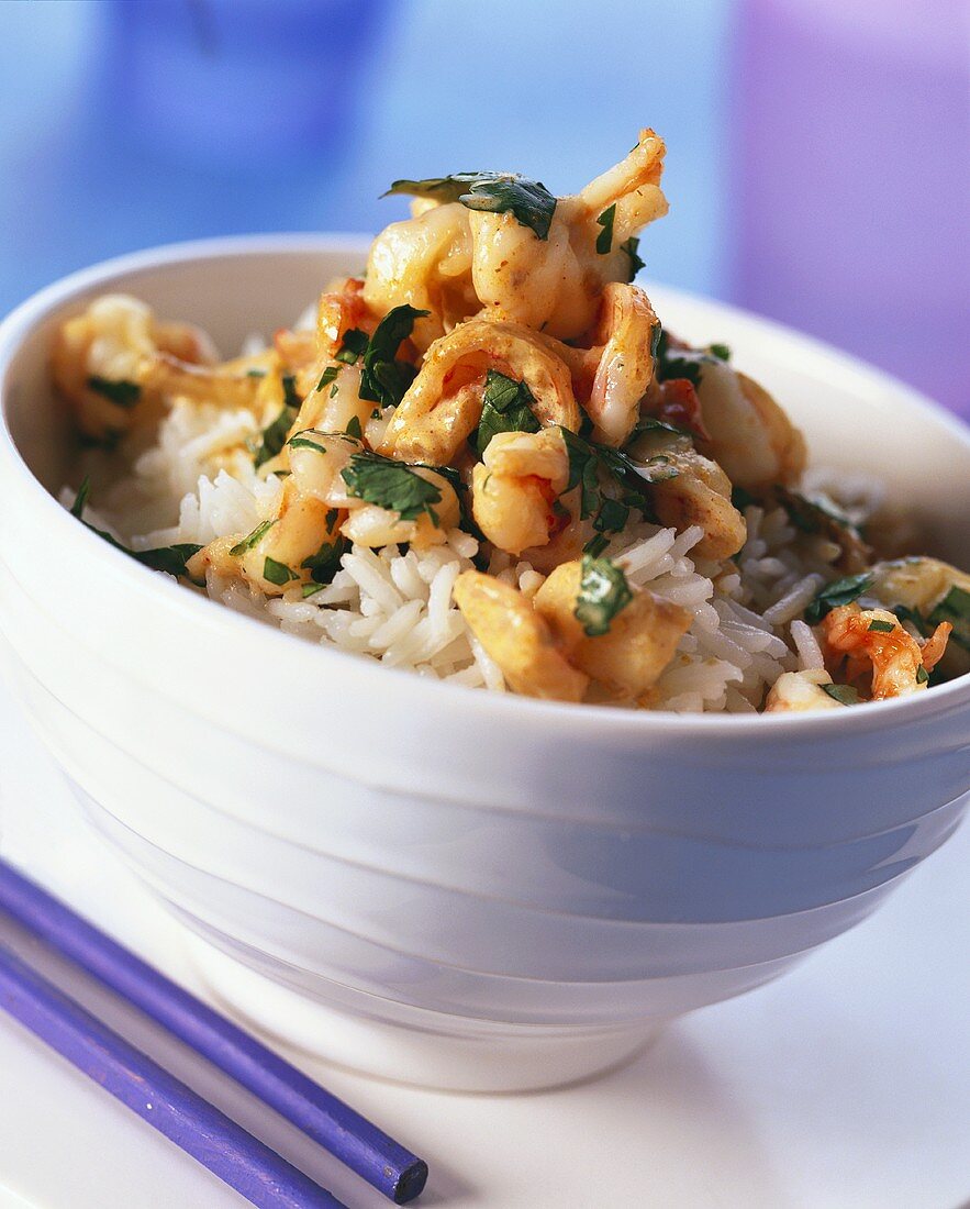 Shrimps and coconut with parsley on rice