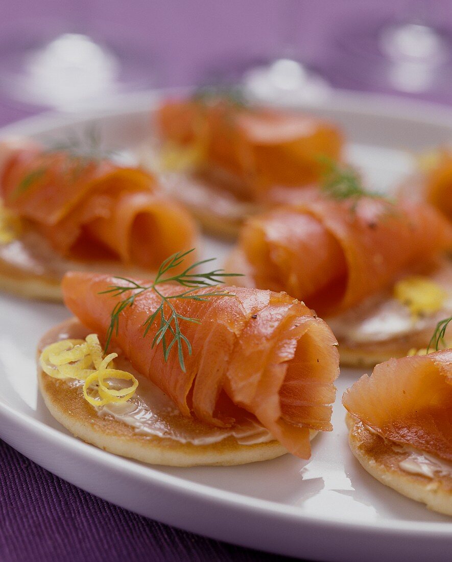 Blinis with salmon rolls