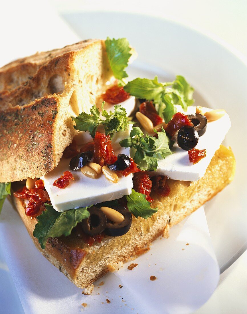 Tuscan sandwich with mozzarella, olives & pine nuts