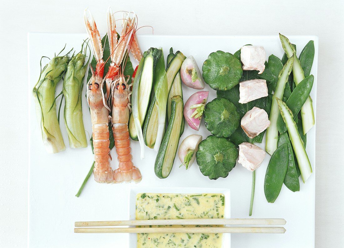 Ingredients for tempura (vegetables, fish, scampi, batter)