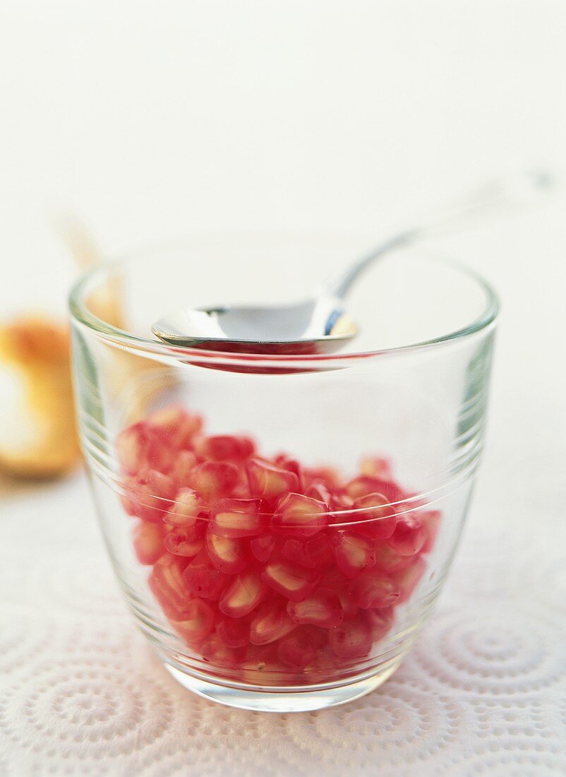 Pomegranates in glass