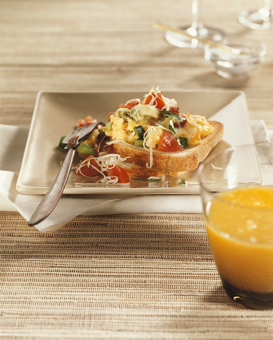 Toast with scrambled egg and vegetables for brunch