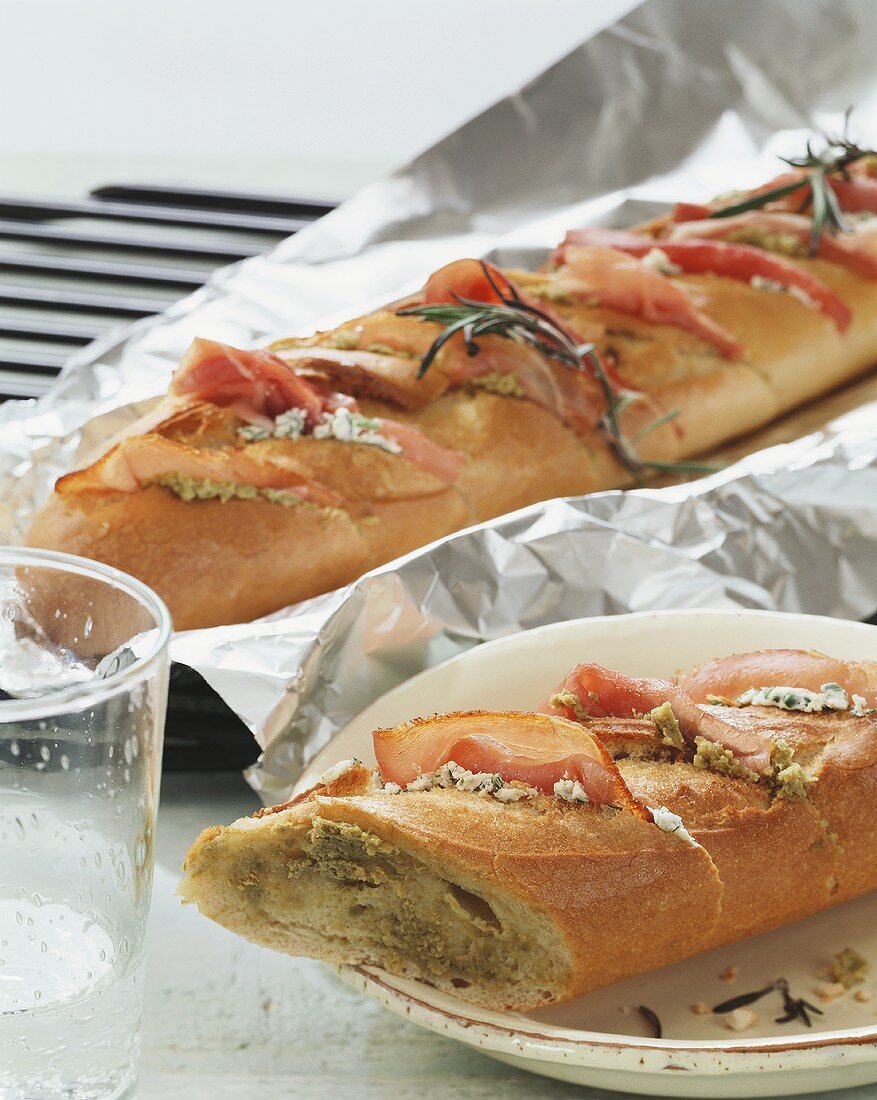 Cheese & ham baguette in aluminium foil ready for grilling
