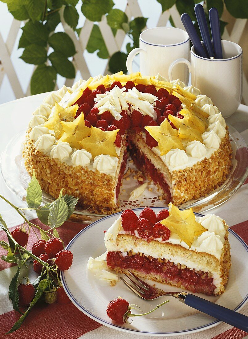 Raspberry cream cake with carambolas