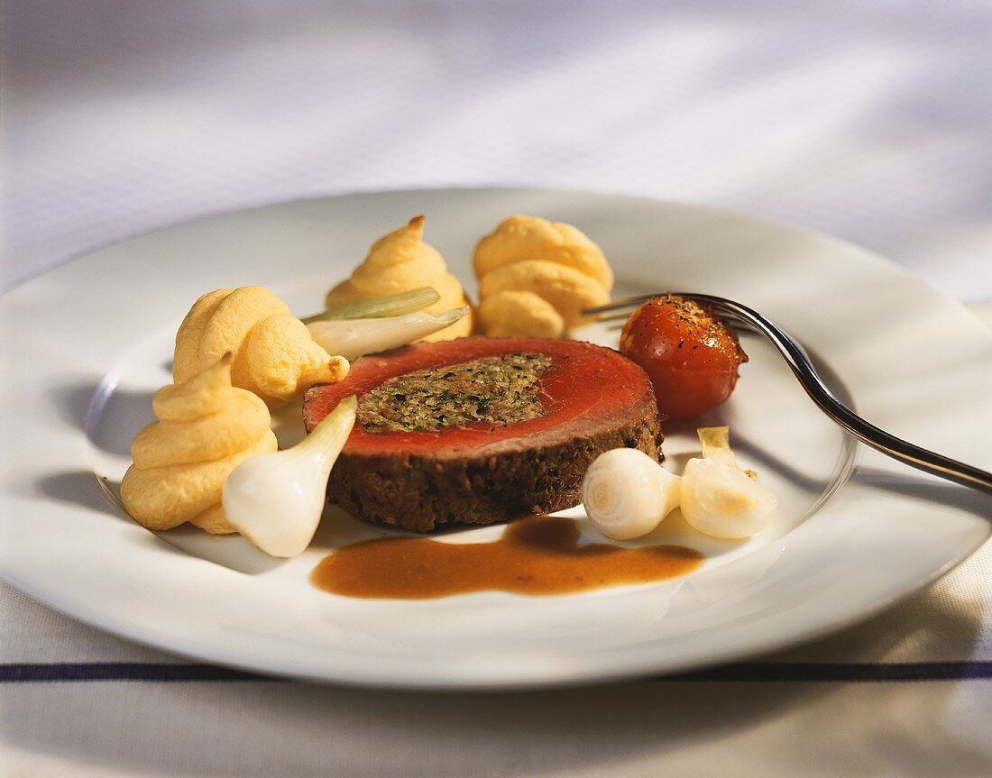 Stuffed roast beef with vegetables and duchess potatoes