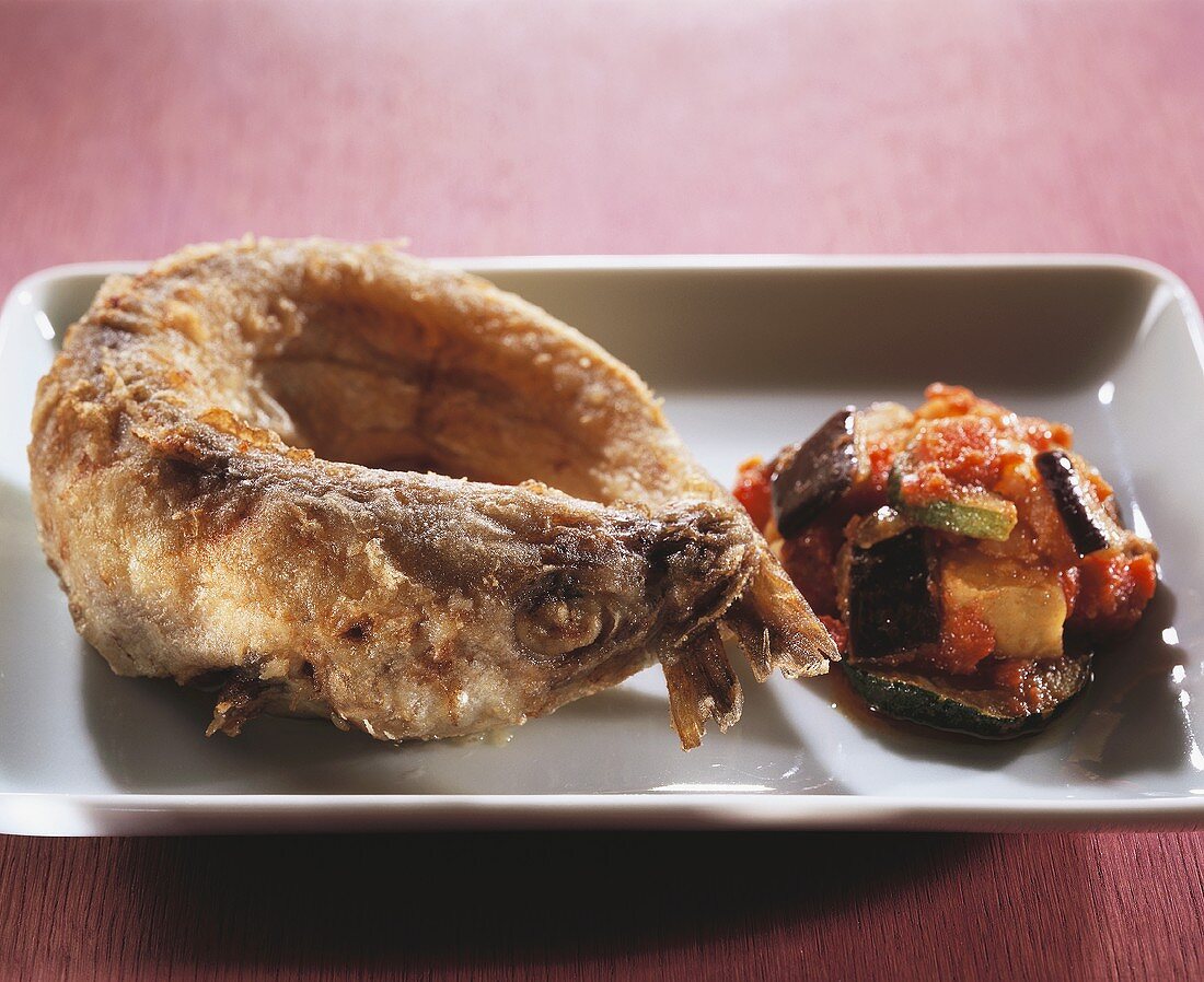 Whole deep-fried whiting with ratatouille