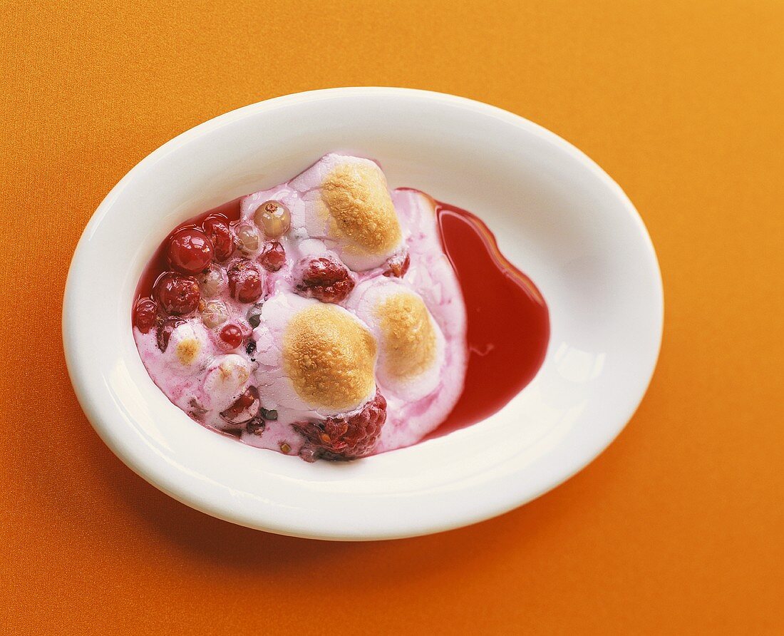 Pink marshmallows with berry sauce