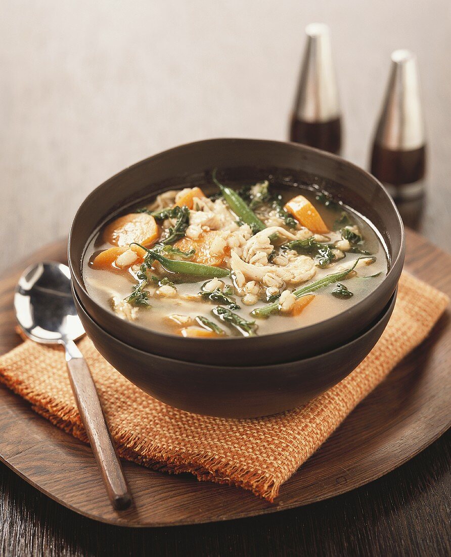 Chicken broth with pearl barley and vegetables