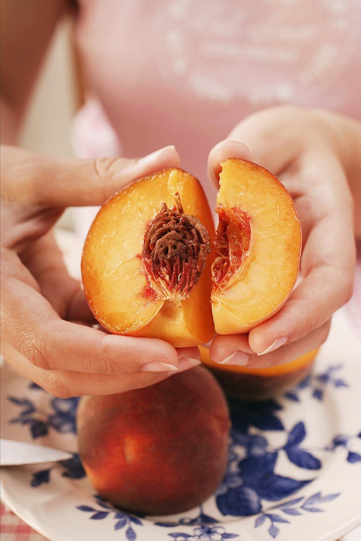 Cutting open a peach