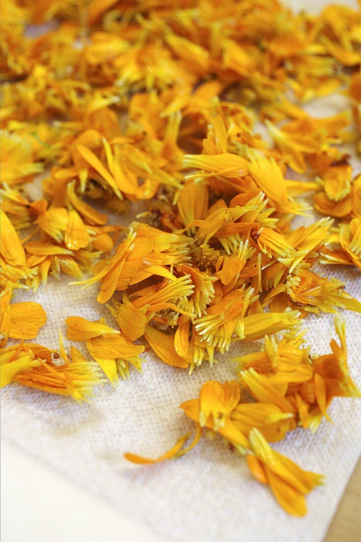 Marigold petals laid out to dry